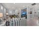 Comfortable living room with striped sofas, a white coffee table, and a modern TV console at 13032 Oriago St, Venice, FL 34293