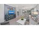Bright living space boasting striped sofas, neutral walls, and an open layout into the kitchen at 13032 Oriago St, Venice, FL 34293