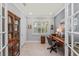 Bright office with desk, cabinet and shutters for plenty of natural light at 13032 Oriago St, Venice, FL 34293