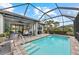 Inviting screened-in pool area with ample seating, perfect for relaxing and entertaining outdoors at 13032 Oriago St, Venice, FL 34293