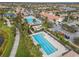 Aerial view showcasing a community with lap pool, Gathering pool, and community center at 13251 Borrego St, Venice, FL 34293
