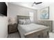 Well-lit bedroom with a ceiling fan and coordinating neutral decor at 13251 Borrego St, Venice, FL 34293