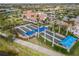 Aerial view of Bocce Ball courts in a community with lush landscaping, sidewalks, and palm trees at 13251 Borrego St, Venice, FL 34293