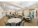 Elegant dining room with ample seating, beautiful chandeliers, neutral colors, and an inviting atmosphere at 13251 Borrego St, Venice, FL 34293