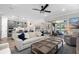 Bright and airy living room with an open layout, neutral tones, and access to the lanai at 13251 Borrego St, Venice, FL 34293