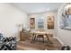 Bright office space with modern desk, nautical art, and a comfortable patterned armchair at 13251 Borrego St, Venice, FL 34293