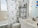 Bathroom featuring a shower-tub combo with a decorative shower curtain, and white vanity at 14 Windward Ter, Placida, FL 33946