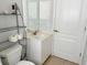 Bathroom featuring white vanity, decorative shelving, and ample lighting at 14 Windward Ter, Placida, FL 33946