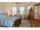 Bright bedroom with large windows, seating area, and neutral decor at 14 Windward Ter, Placida, FL 33946