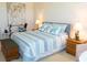 Inviting bedroom with striped bedding, neutral decor, and natural light at 14 Windward Ter, Placida, FL 33946