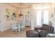 Open-concept dining room adjacent to a seating area with access to the front entry at 14 Windward Ter, Placida, FL 33946