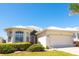 Charming single-story home showcasing a well-manicured lawn and a two-car garage at 14 Windward Ter, Placida, FL 33946
