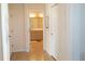 Hallway featuring a tiled floor and an open door to the bathroom at 14 Windward Ter, Placida, FL 33946