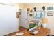 Cozy home office with light walls, large desk, and personal decor at 14 Windward Ter, Placida, FL 33946