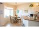 Cozy breakfast nook with a round table, views of backyard, and a bright, welcoming atmosphere at 14 Windward Ter, Placida, FL 33946