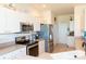 Kitchen view featuring white cabinetry, stainless appliances, and tile flooring at 14 Windward Ter, Placida, FL 33946