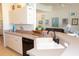 Kitchen with breakfast bar area, white cabinets, and black dishwasher at 14 Windward Ter, Placida, FL 33946