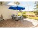 Screened patio featuring brick flooring, outdoor furniture, and views of the backyard at 14 Windward Ter, Placida, FL 33946