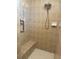 Tiled walk-in shower featuring a shower head, soap dish, and bench at 14 Windward Ter, Placida, FL 33946