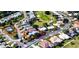 Aerial view showcasing various houses in a neighborhood with a golf course running through the community at 1400 Colony Pl, Venice, FL 34292