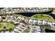 Aerial view of a residential neighborhood featuring a golf course and lakes at 1400 Colony Pl, Venice, FL 34292