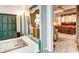 View of a bedroom with a sitting area and sliding glass doors leading to a balcony at 1400 Colony Pl, Venice, FL 34292