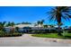 Waterford Sports Club showcases a pristine building with lush landscaping, enhancing curb appeal and a welcoming atmosphere at 1400 Colony Pl, Venice, FL 34292