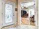Inviting foyer with decorative front door that opens into the living area at 1400 Colony Pl, Venice, FL 34292