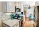 View of kitchen with stainless appliances, and a turquoise dining set at 1400 Colony Pl, Venice, FL 34292