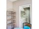 Laundry room with modern washer and dryer, shelving and storage at 1400 Colony Pl, Venice, FL 34292