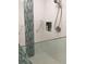 Modern shower with sleek fixtures, built-in shelving, and frameless glass door at 1400 Colony Pl, Venice, FL 34292