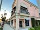 Elegant building exterior with decorative balconies and awnings on a sunny street at 1400 Colony Pl, Venice, FL 34292