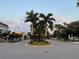 Picturesque street view with lush palm trees lining the median, enhancing the town's tropical charm at 1400 Colony Pl, Venice, FL 34292