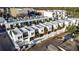 Aerial view of modern townhouses with rooftop patios, showcasing city living at 1558 4Th St # 208, Sarasota, FL 34236