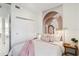 Bedroom with sliding closet door, arched wall art, and a cozy aesthetic at 1558 4Th St # 208, Sarasota, FL 34236