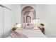 Comfortable bedroom with decorative wall art, soft lighting, and a cozy bed at 1558 4Th St # 208, Sarasota, FL 34236