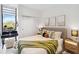 Charming bedroom with desk nook, stylish decor, and a cozy queen-sized bed at 1558 4Th St # 208, Sarasota, FL 34236