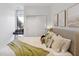Bright bedroom with a desk, modern decor, and a closet with sliding doors at 1558 4Th St # 208, Sarasota, FL 34236