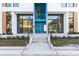 A building exterior showcasing two separate entry doors with glass panels at 1558 4Th St # 208, Sarasota, FL 34236