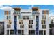 Stylish townhouse complex with contemporary design, featuring balconies and large windows at 1558 4Th St # 208, Sarasota, FL 34236