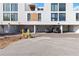Modern townhouse complex garage featuring parking spaces and overhead doors at 1558 4Th St # 208, Sarasota, FL 34236