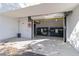 Townhouse complex garage with trash bins inside, providing convenient waste disposal at 1558 4Th St # 208, Sarasota, FL 34236