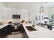 Well-lit kitchen with marble countertops, stainless steel appliances, and modern cabinetry at 1558 4Th St # 208, Sarasota, FL 34236