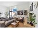 Cozy living room featuring a comfortable sofa, stylish decor, and a large window at 1558 4Th St # 208, Sarasota, FL 34236