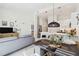 Open living space with a modern kitchen, dining area, and comfortable living room setup at 1558 4Th St # 208, Sarasota, FL 34236