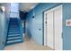 Stairway to the second floor and elevator access at 1558 4Th St # 208, Sarasota, FL 34236