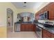 Stylish kitchen featuring stainless steel appliances and a breakfast bar looking into the dining area at 1567 Monarch Dr, Venice, FL 34293