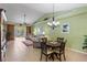 Inviting living room with vaulted ceiling, neutral walls, and slider doors to the patio at 1567 Monarch Dr, Venice, FL 34293