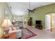 Spacious living room with neutral walls, a ceiling fan and access to all rooms in the house at 1567 Monarch Dr, Venice, FL 34293