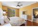 This is the main bedroom with a king bed that includes sliding glass doors and hardwood floors at 1567 Monarch Dr, Venice, FL 34293